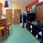 Inside of Distillery. Tasting area, merchandise area, and restroom doors.